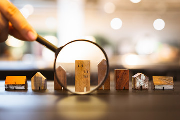 image depicting calculator beside dummy house